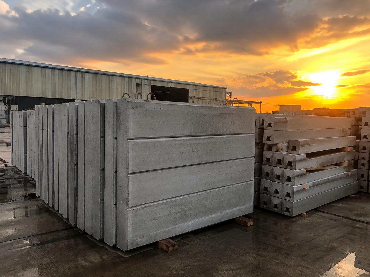 Precast Concrete Boundary Walls — Stacked · panels and columns ready for site